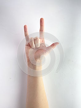 Hand make rock and roll sign simbol  on white background male female black silver ok gestures finger Caucasian arm close