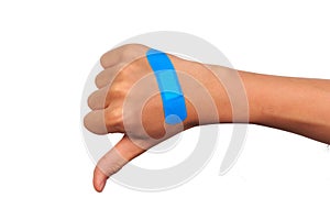 Hand making sign putting adhesive bandage or plaster. band-aid on a cut.