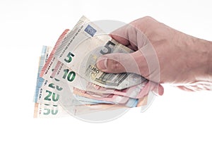 Hand of male person handing over different euro bills