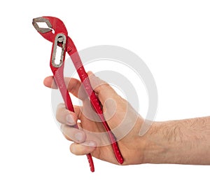 Hand of male plumber with a red wrench