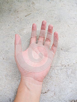 Hand man on cement floor