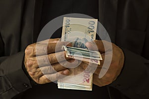 Hand Of Man Is Counting His Money. photo