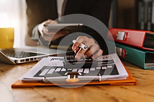 Hand man doing finances and calculate on desk about cost