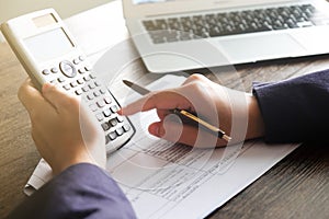 Close up of Hand man doing finances and calculate on desk about cost at home office.Savings, finances and economy concept.