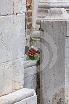 Hand of a man with a glass of coffee