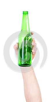 Hand of a man hiding a green bottle of beer isolated on the empty white background