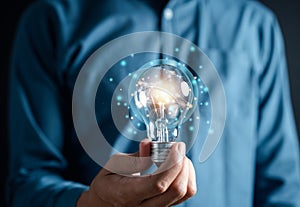 Hand man holding illuminated lightbulb, idea, innovation and inspiration with glowing virtual brain, smart intelligent creativity