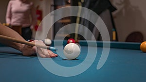 Hand of a man playing billiard