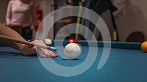 Hand of a man playing billiards