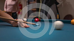 Hand of a man playing billiards