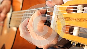 Hand of man playing guitar