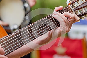hand of a man playing a Spanish guitar, music concept