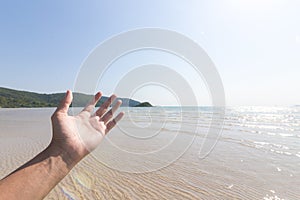 Hand of a man reaching to towards sky. Hand make symbol.