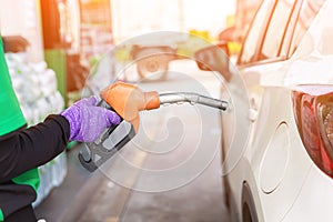 Hand Man Refill and filling Oil Gas Fuel at station. Gas station - refueling. To fill the machine with fuel. Car fill with gasolin