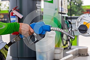 Hand Man Refill and filling Oil Gas Fuel at station. Gas station - refueling. To fill the machine with fuel. Car fill with gasolin