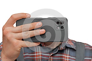 Hand of a man in shirt close-up holding a mobile phone or smartphone in a grey case on a white background, isolated