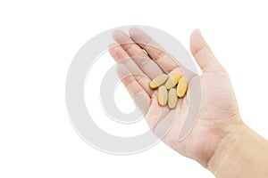 hand of a man with some pills on white background