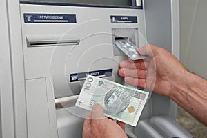 Hand of a man using banking machine