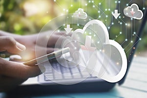 Hand man using laptop computer for doing cloud uploading data on the Internet online