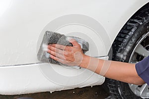 Hand man worker washing car