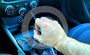 Hand on manual gear shift knob
