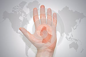 Hand with map of luxembourg on the gray world map background