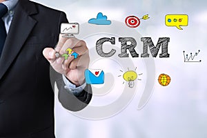 Hand with marker writing: CRM