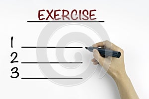 Hand with marker writing - Exercise blank list, fitness, sport,