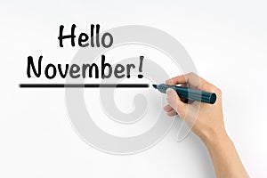 Hand with marker writing Hello November!