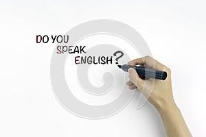 Hand with marker writing text: Do you speak english?
