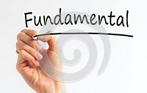 Hand with marker writing the word Fundamental, concept, stock image