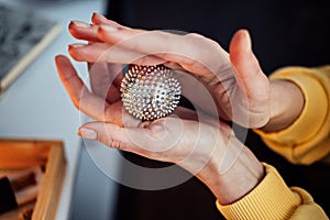 Hand massage Acupuncture Su Jok ball for hands and fingers. Sujok, su jok, su-jok traditional Chinese medicine therapy