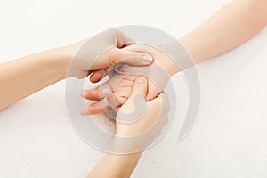 Hand massage closeup, acupressure photo