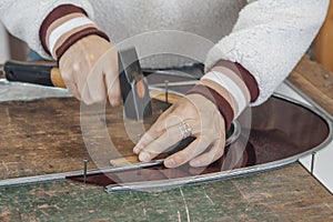 hand of master glassmaker at work