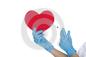 Hand with medical glove makes shot in the heart