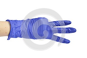 Hand in a medical glove shows three fingers