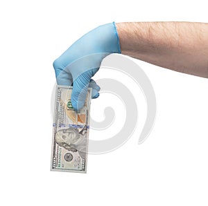 Hand in medical gloves holding money over white background