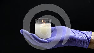 In the hand of the men glows a candle of memory