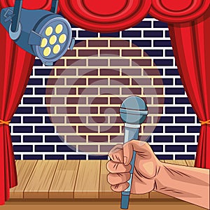 Hand with microphone spotlight wall brick stage stand up comedy show