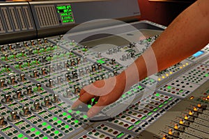 Hand on mixing console