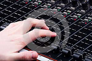 Hand on Mixing Console