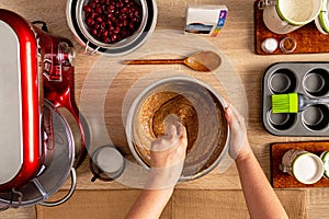 Hand mixing ingredients needed for muffin dough