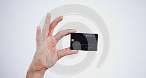 Hand, money and closeup of credit card in a studio for online shopping, paying bills or debt. Ecommerce, payment and