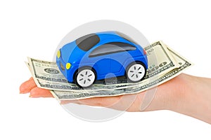 Hand with money and toy car