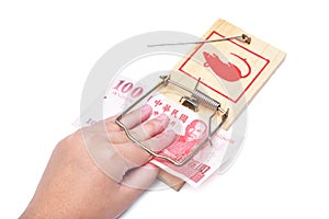 Hand and mousetrap with money