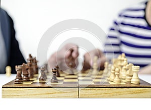 hand move figures on a chessboard