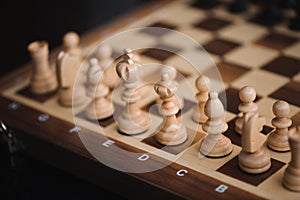 Hand moving chess figure in competition success play.