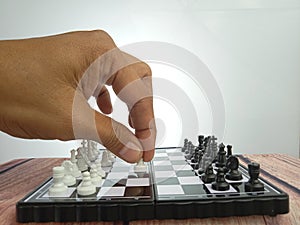 Hand Moving Chess, Illustration for photo War, battle, politic situation concept at gray background