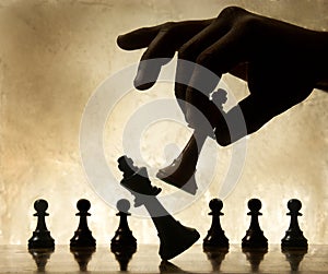 Hand moving chess piece