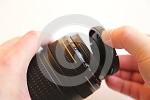 Hand moving lens cap